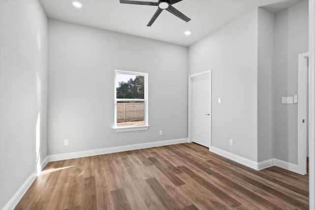 empty room featuring hardwood / wood-style flooring and ceiling fan