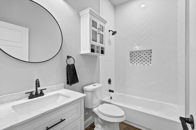 full bathroom featuring vanity, tub / shower combination, and toilet