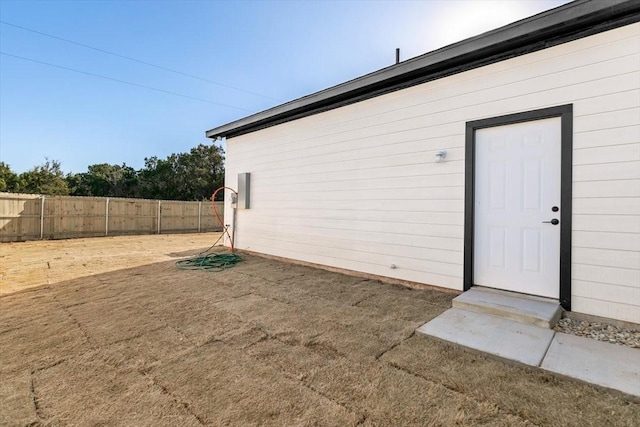 doorway to property featuring a lawn