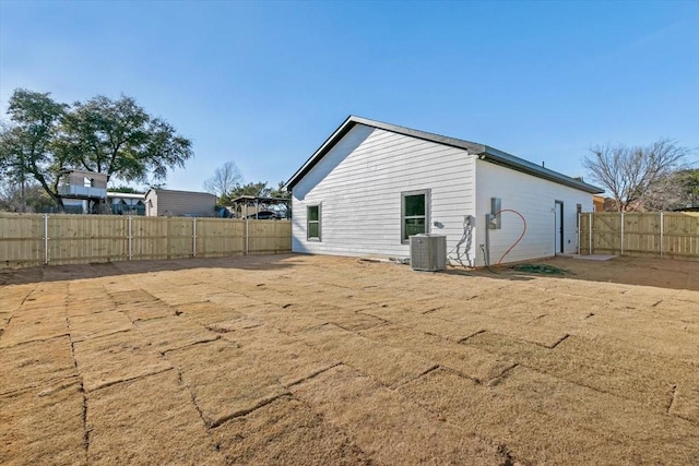 view of side of property with central AC unit