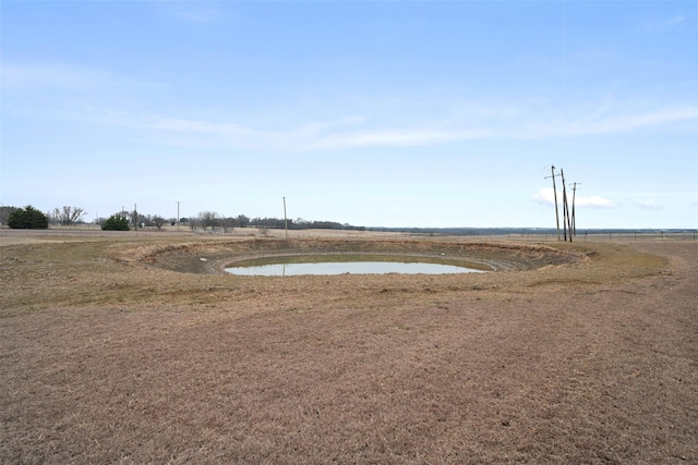 view of yard featuring a rural view and a water view