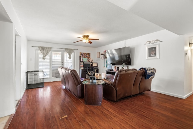 living room featuring dark hardwood / wood-style floors and ceiling fan