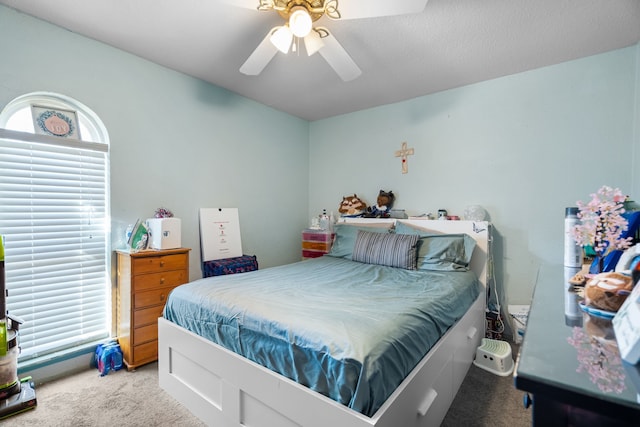 carpeted bedroom with ceiling fan