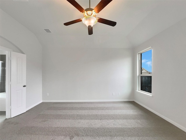 spare room with lofted ceiling and carpet floors