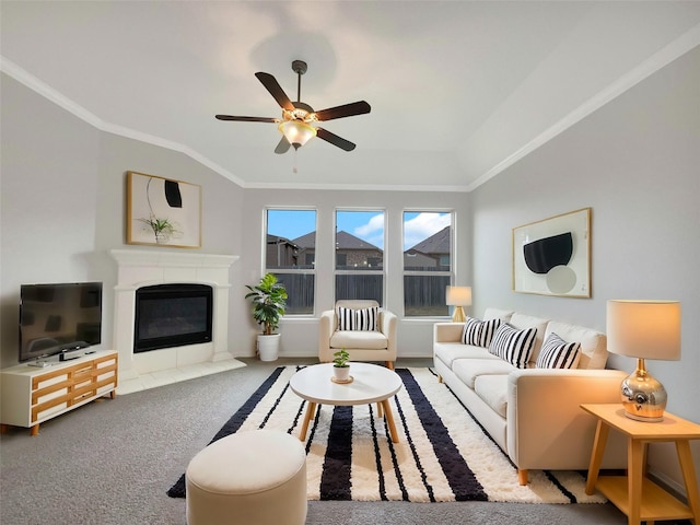 living room featuring ornamental molding, carpet floors, and a tile fireplace