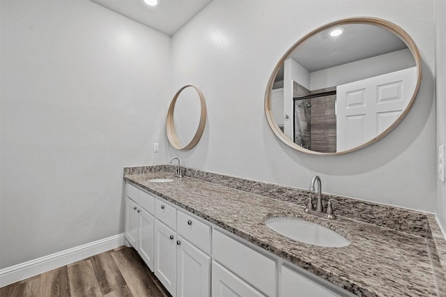 bathroom featuring wood-type flooring and vanity