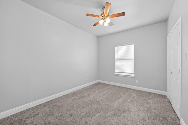 carpeted empty room with ceiling fan