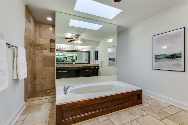 bathroom featuring vanity, crown molding, a skylight, and shower with separate bathtub