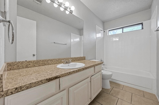 full bathroom with tile patterned flooring, vanity, toilet, bathing tub / shower combination, and a textured ceiling