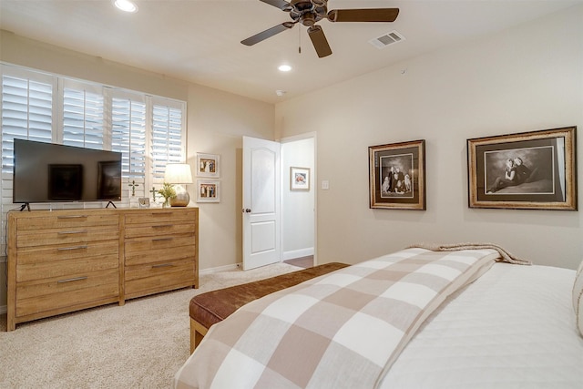 bedroom with light colored carpet and ceiling fan