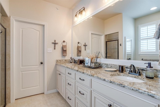 bathroom with vanity, tile patterned floors, and walk in shower