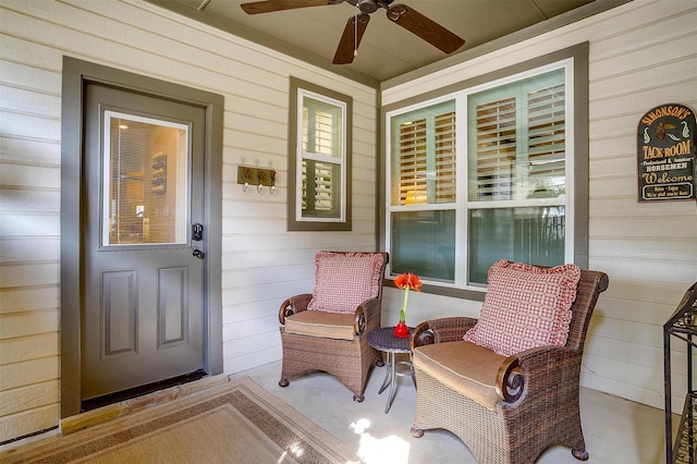 doorway to property with ceiling fan