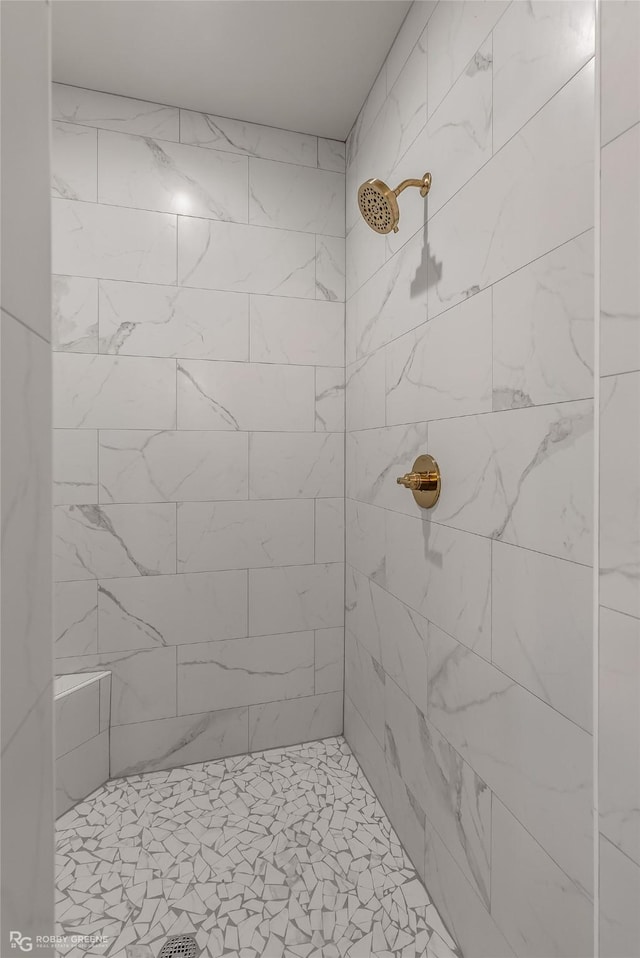 bathroom with tiled shower