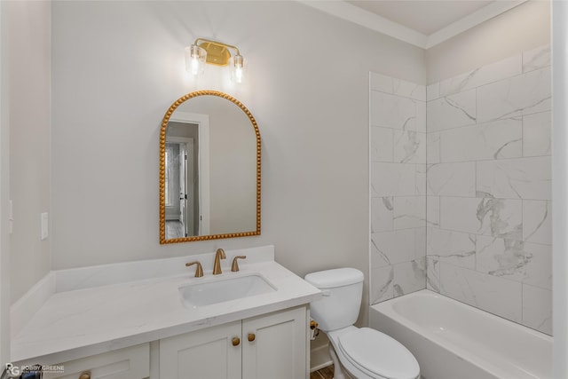 full bathroom with tiled shower / bath, vanity, and toilet