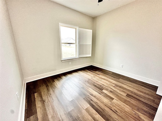 unfurnished room with wood-type flooring and ceiling fan