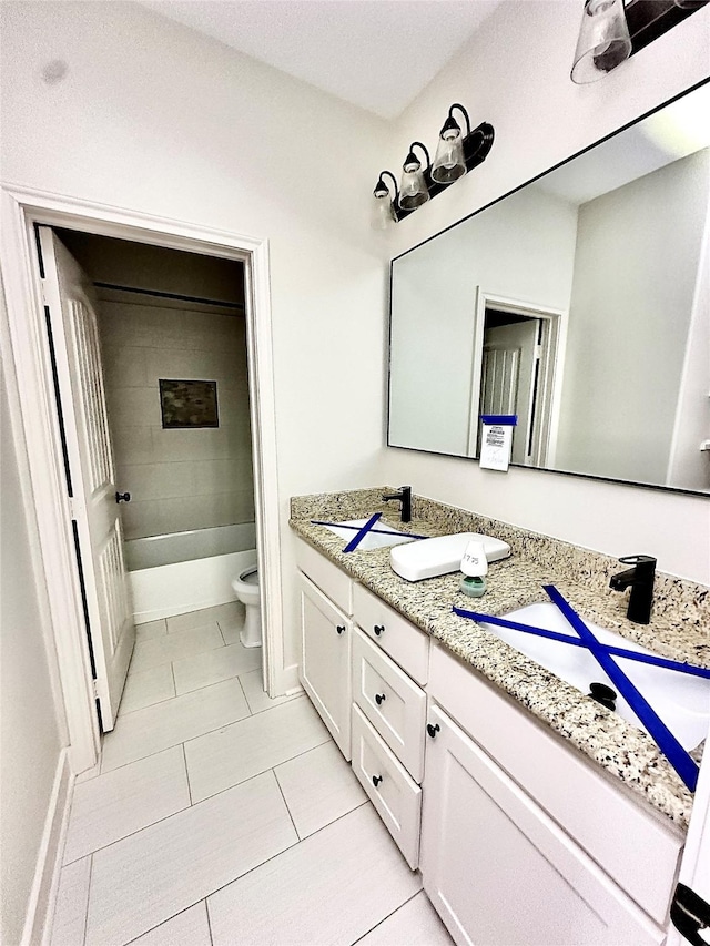 full bathroom featuring vanity, toilet, tiled shower / bath combo, and tile patterned flooring