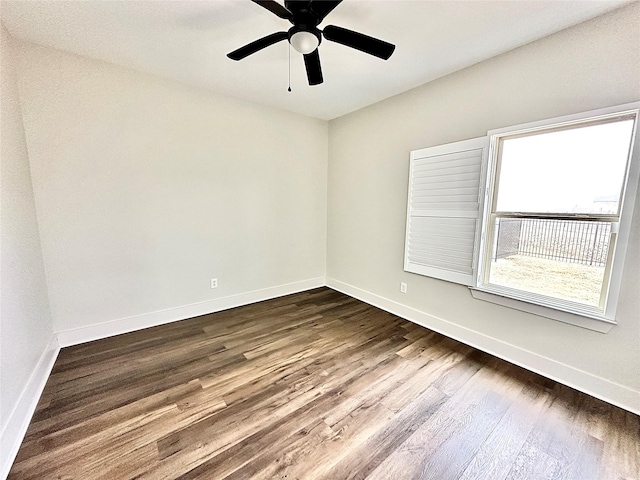 unfurnished room with hardwood / wood-style flooring and ceiling fan