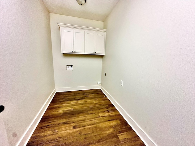 washroom with hookup for a washing machine, cabinets, hookup for an electric dryer, and dark hardwood / wood-style flooring