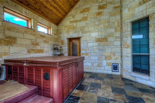 misc room with vaulted ceiling and wooden ceiling