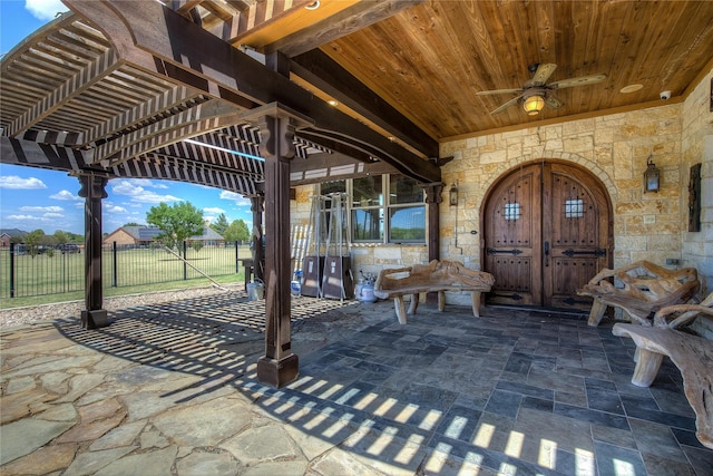 exterior space with a pergola and ceiling fan