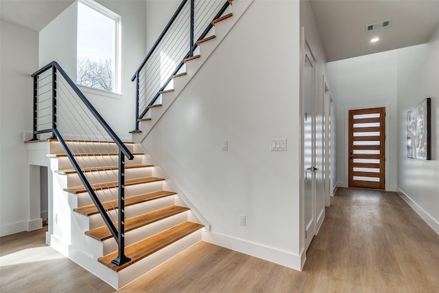 stairway featuring hardwood / wood-style flooring