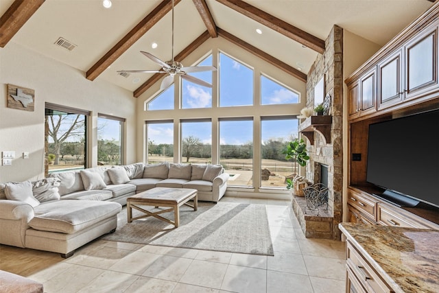 tiled living room with beam ceiling, a fireplace, high vaulted ceiling, and ceiling fan