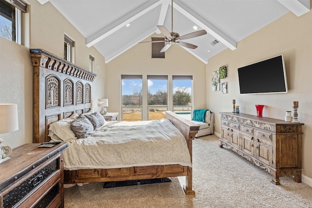 carpeted bedroom with ceiling fan and vaulted ceiling with beams