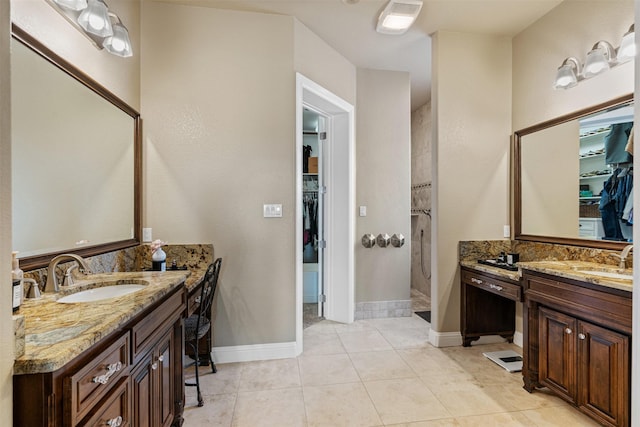 bathroom with vanity, tile patterned floors, and walk in shower