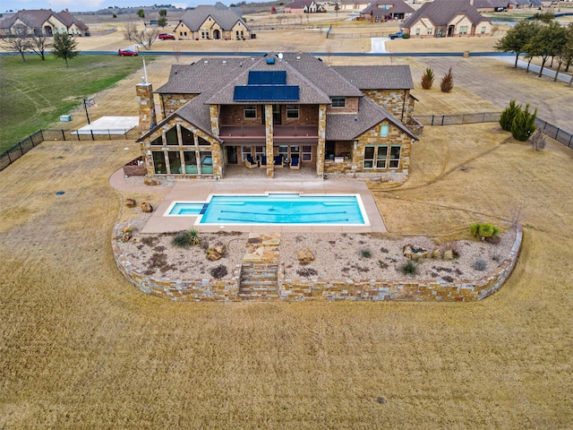 view of swimming pool featuring a lawn and a patio area