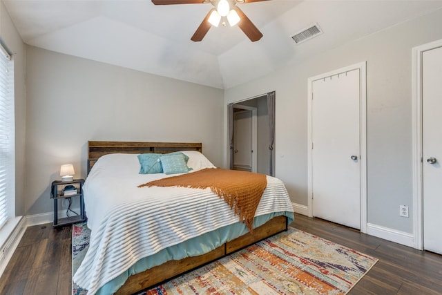 bedroom featuring lofted ceiling, dark wood-type flooring, and ceiling fan