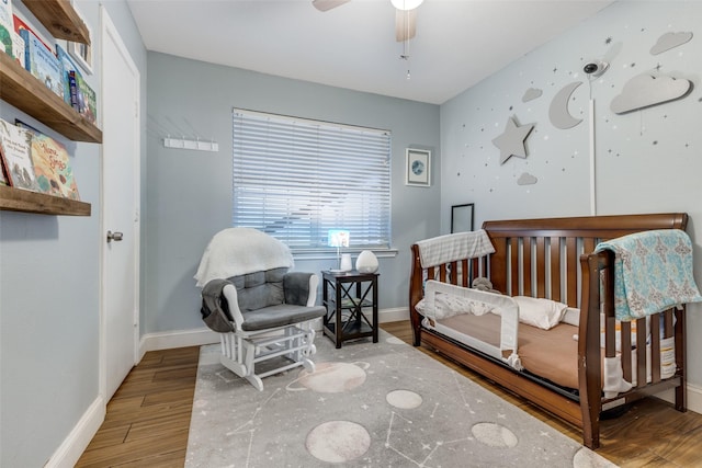 bedroom featuring ceiling fan and wood-type flooring