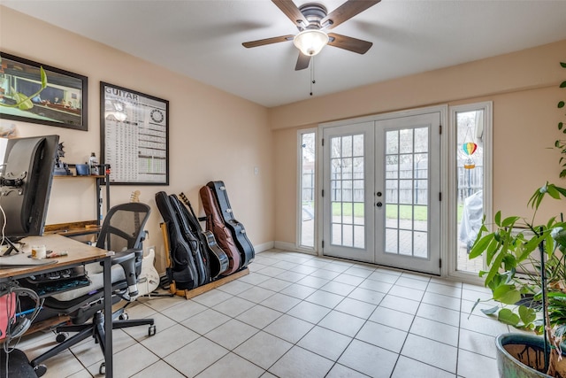 home office with french doors, ceiling fan, and light tile patterned floors