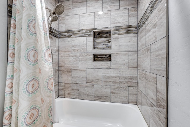 bathroom featuring shower / tub combo with curtain