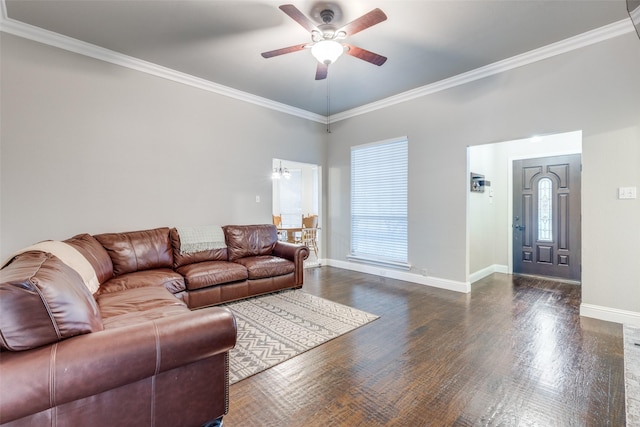 living room with crown molding, dark hardwood / wood-style floors, and ceiling fan