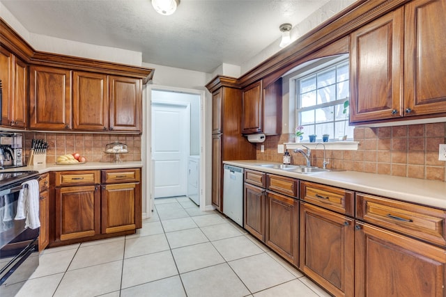 kitchen with light tile patterned flooring, sink, tasteful backsplash, electric range, and stainless steel dishwasher