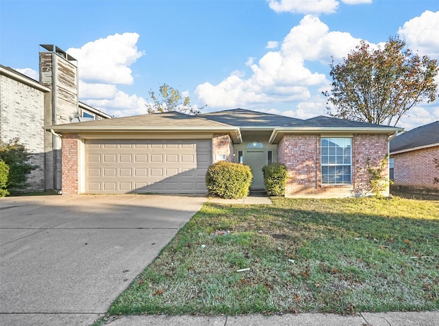 view of front of property featuring a garage and a front lawn