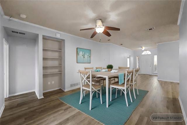 dining area featuring ceiling fan, ornamental molding, wood-type flooring, and built in features