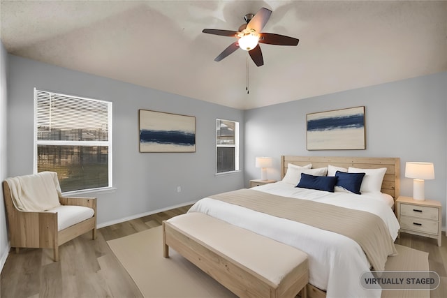 bedroom with light wood-type flooring and ceiling fan