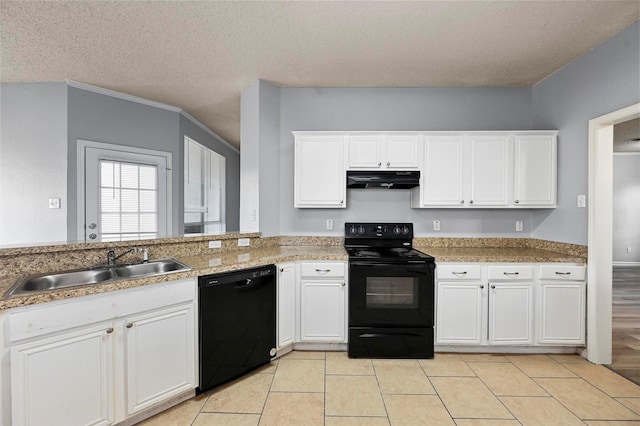 kitchen featuring light tile patterned floors, white cabinets, a textured ceiling, and black appliances