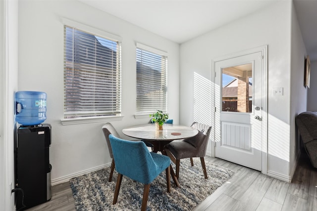 dining space with light wood-type flooring