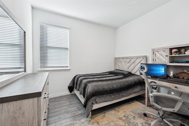 bedroom with light hardwood / wood-style flooring