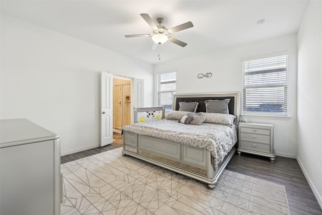 bedroom featuring connected bathroom, ceiling fan, and light hardwood / wood-style floors