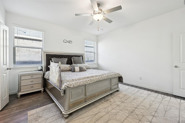 bedroom featuring hardwood / wood-style flooring and ceiling fan