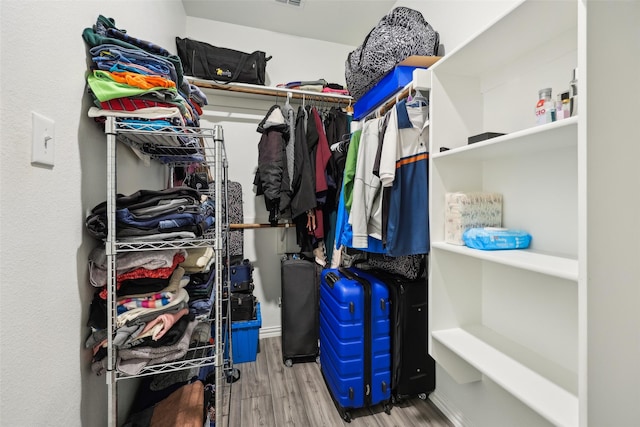 spacious closet featuring light wood-type flooring