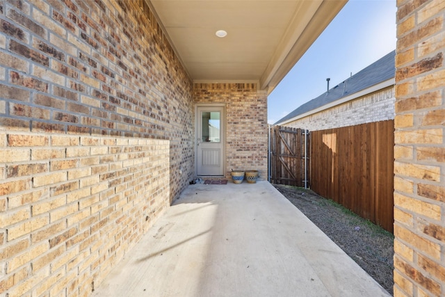 property entrance featuring a patio area