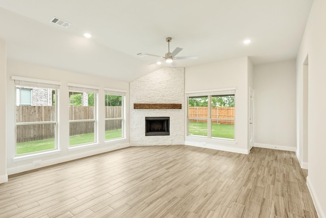 837 Rusty Run Dr, Midlothian, TX 76065 - unfurnished living room featuring ceiling fan, healthy amount of natural light, light wood finished floors, baseboards, and vaulted ceiling