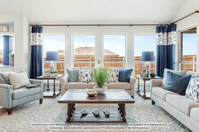 sunroom with lofted ceiling and a healthy amount of sunlight