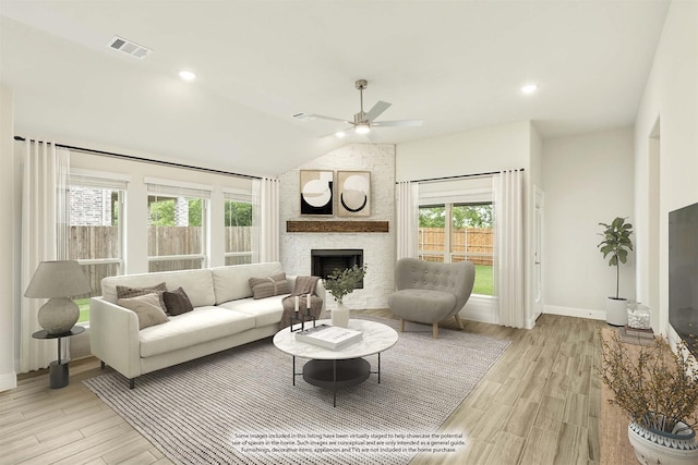 837 Rusty Run Dr, Midlothian, TX 76065 - living area with ceiling fan, light wood finished floors, a fireplace, baseboards, and vaulted ceiling