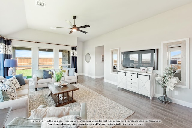 living room featuring ceiling fan, lofted ceiling, and hardwood / wood-style floors