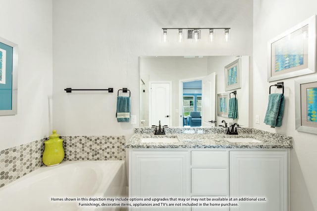 bathroom featuring vanity and a tub to relax in